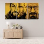 ثلاث لوحات قماشية بتصميم مسلسل Breaking Bad بألوان صفراء تبرز شخصيات رئيسية بأسلوب فني مميز.