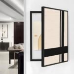 لوحة كانفس باللون البيج مع تصميم خطوط سوداء في إطار أسود، مثالية لتغطية طبلون الكهرباء.