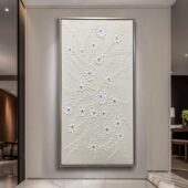لوحة جبس بتصميم مزهري بلون أبيض مع إطارات شامبين، تضفي لمسة فنية وعصرية على الجدران.