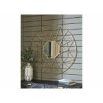 مرآة جدارية دائرية بتصميم هندسي، إطار ذهبي أنيق، تضيف لمسة عصرية لأي مساحة.