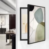 لوحة كانفس بألوان هادئة وتصميم هندسي، إطار أسود، تستخدم لتغطية طبلون الكهرباء.
