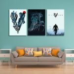 ثلاث لوحات قماشية ملونة بتصميم شخصيات من مسلسل فايكنغ، تتضمن رسومات فنية مميزة.