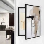لوحة كانفس فنية بألوان دافئة، إطار أسود أنيق، تصميم عصري يناسب تغطية طبلون الكهرباء.