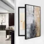 لوحة كانفس فنية بألوان محايدة، إطار أسود، تناسب تغطية طبلون الكهرباء في التصميم الداخلي.