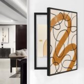 لوحة كانفس بتصميم هندسي بألوان دافئة، إطار أسود، مثالية لتغطية طبلون الكهرباء.
