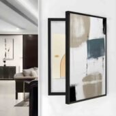 لوحة كانفس بتصميم حديث، إطار أسود، ألوان دافئة مع لمسات زرقاء، مثالية لتغطية طبلون الكهرباء.