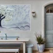 لوحة جبسية ثلاثية الأبعاد بتصميم شجرة بيضاء على خلفية رمادية، تضيف لمسة فنية للمكان.