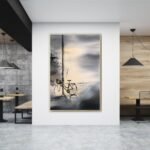 لوحة قماشية بتصميم مودرن تعكس مشهد دراجة في أجواء ضبابية، بإطار مجوف أنيق وألوان هادئة.